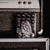 Vintage-style amplifier with 'The First Herald' branding on a black background